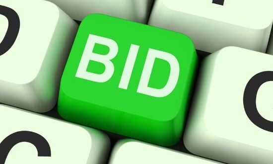 Tasto verde BID su tastiera bianca.