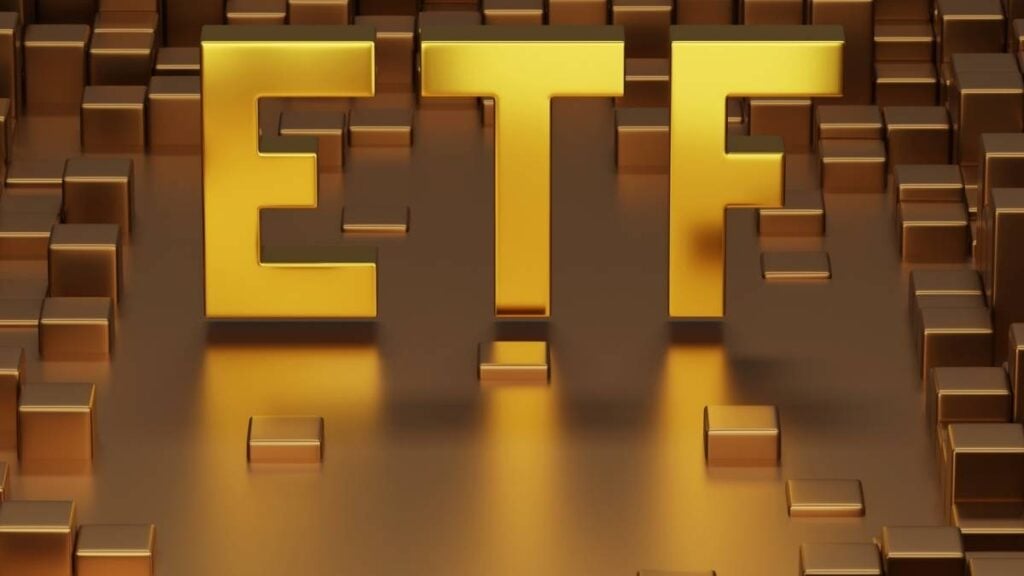 scritta etf su fondo dorato pixel
