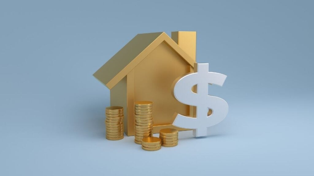 casa con simbolo di dollaro e monete
